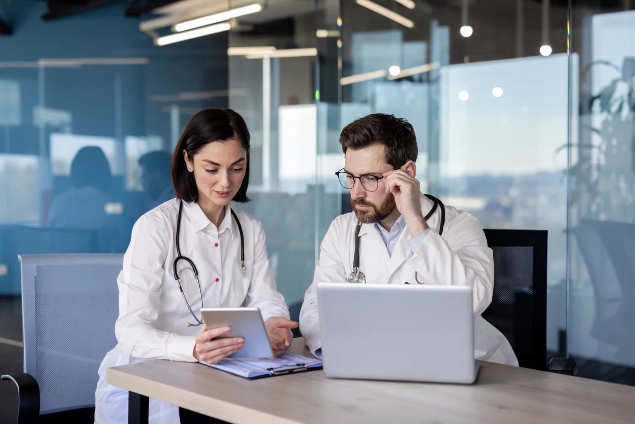 Hospital IT security team reviewing incident response decision tree distinguishing standard EHR downtime procedures from ransomware containment and isolation protocols