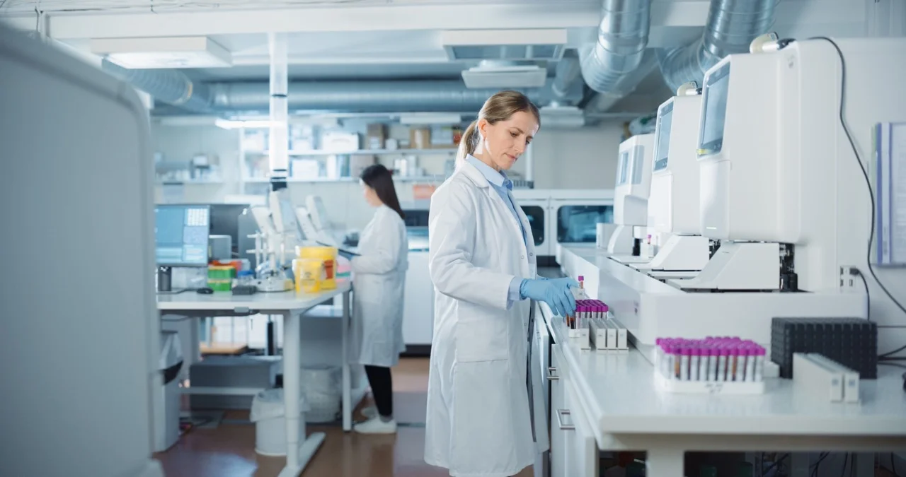 Clinical lab staff managing specimen orders and labels from a downtime workstation during an EHR outage