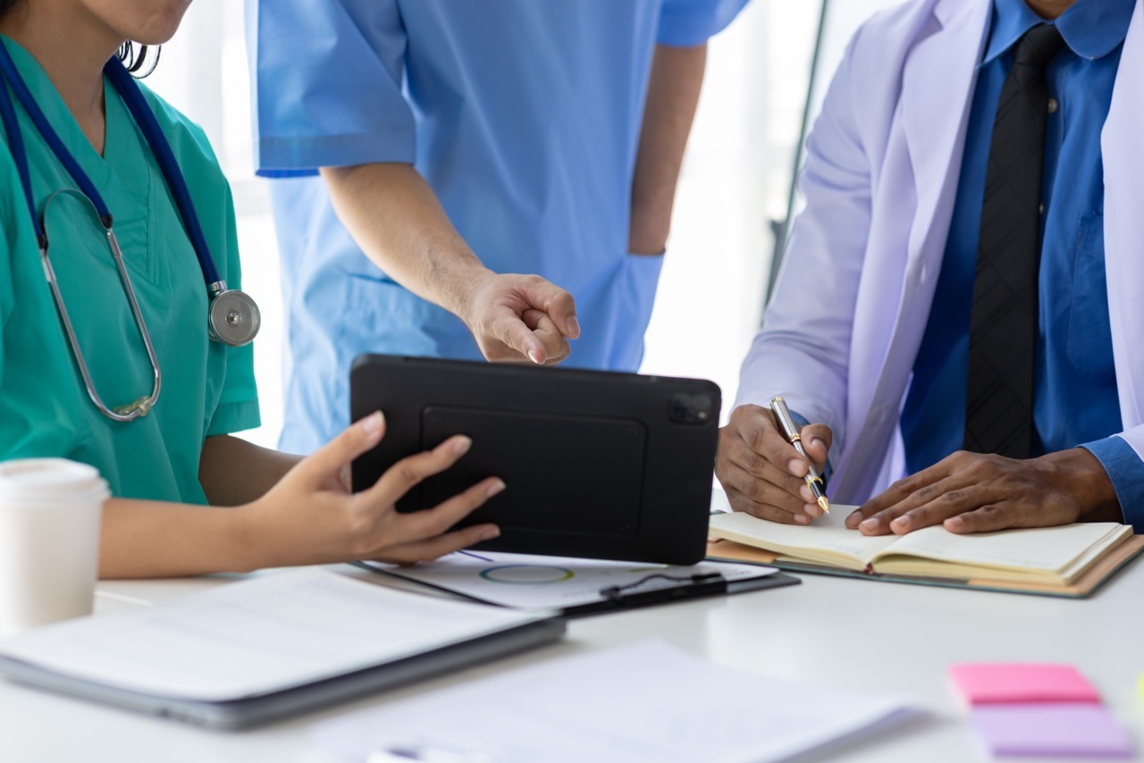 A nurse completing an interactive eForm on a tablet during an EHR outage