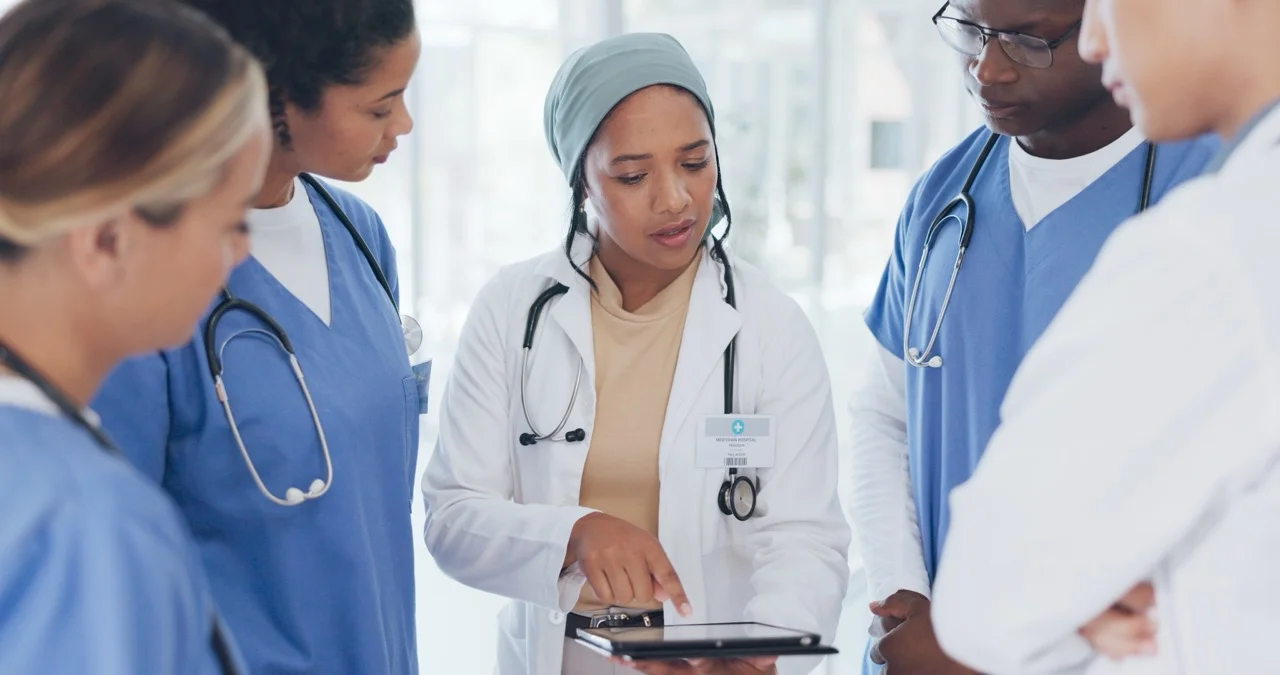 Charge nurse managing unit communication and staff coordination during an EHR downtime event