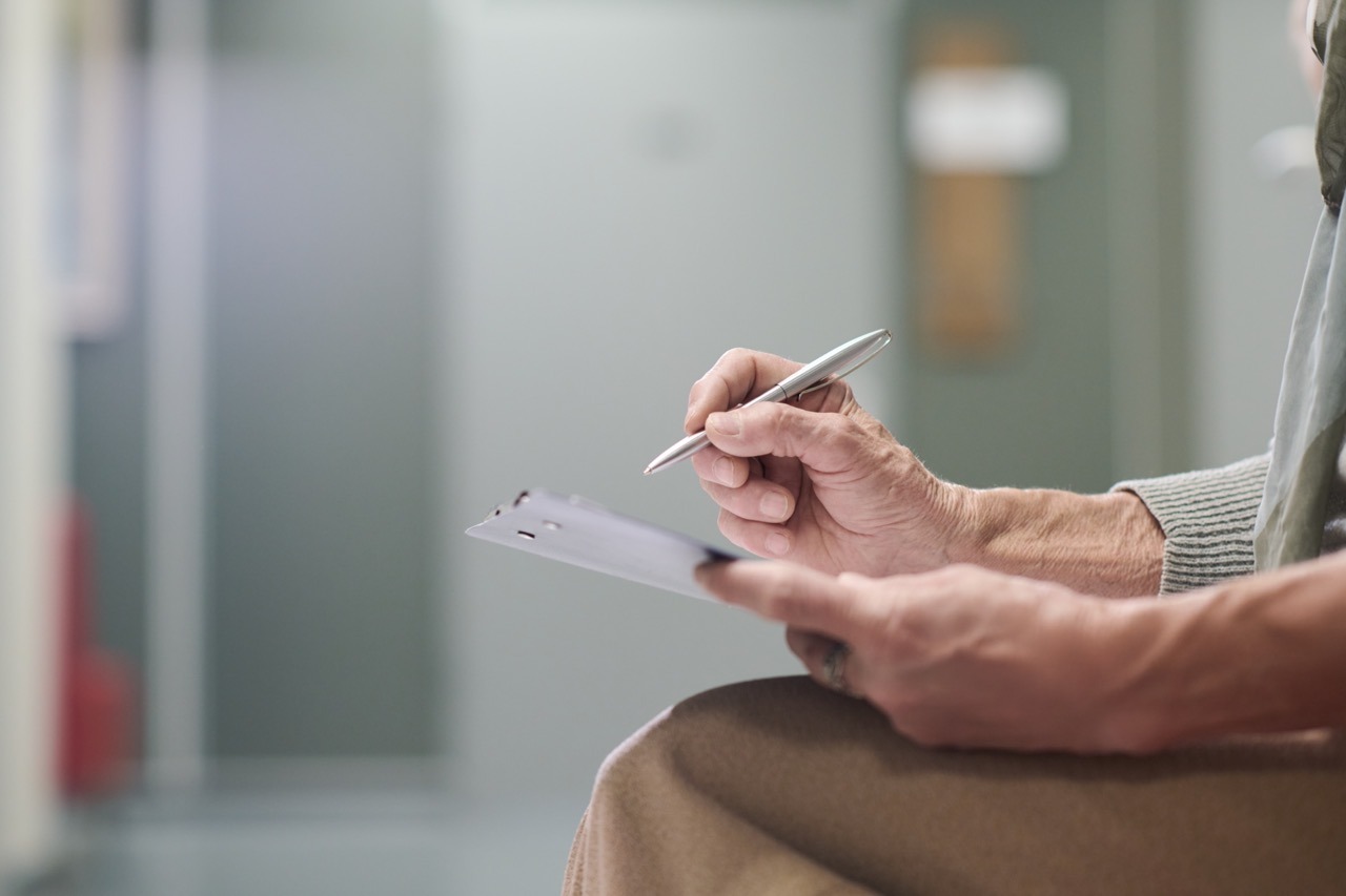 IT and compliance staff reviewing HIPAA contingency plan documentation during an EHR outage
