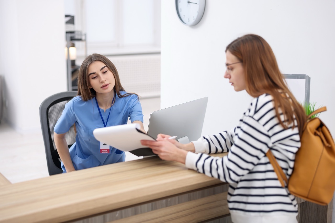 healthcare staff completing an electronic consent form on a tablet using dbtech eForms
