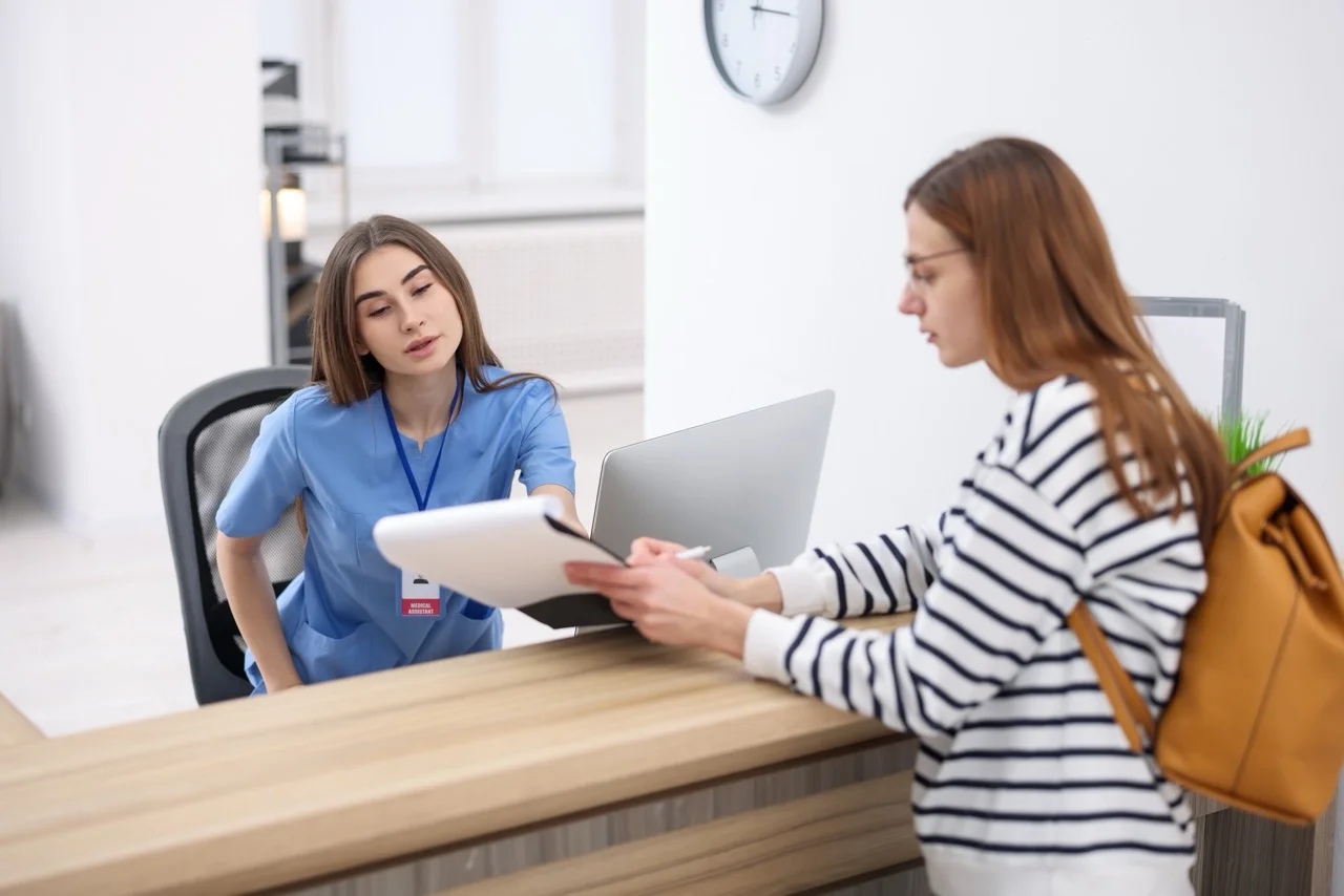 healthcare staff completing an electronic consent form on a tablet using dbtech eForms