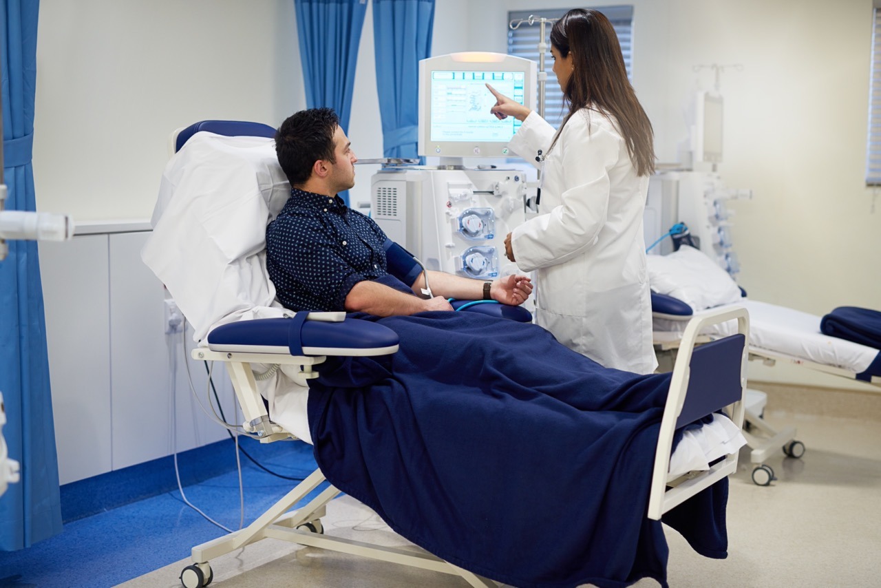 Clinical staff managing a dialysis treatment workflow during an EHR downtime event