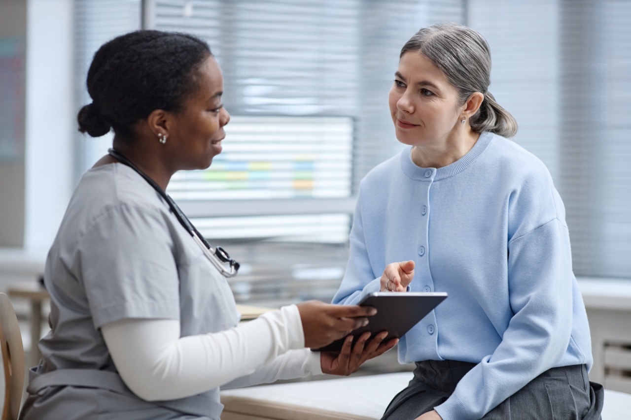 Patient completing a digital intake eForm on a tablet at registration