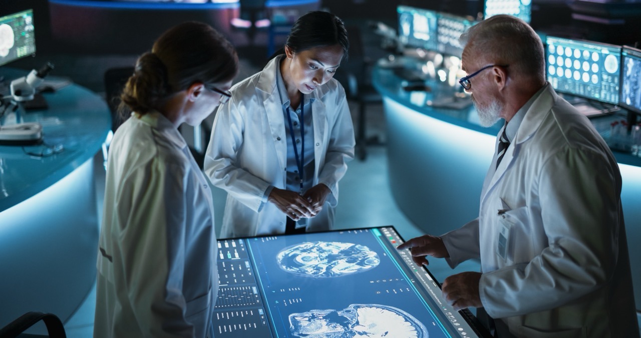 Hospital IT security team assessing downtime preparedness against a cyber threat dashboard