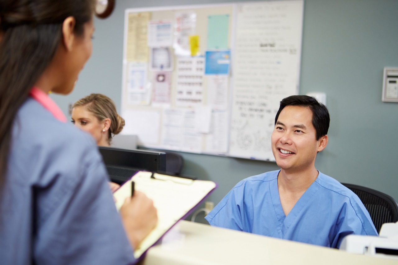 Nurses coordinating at a nurses station during the first 30 minutes of an EHR outage response
