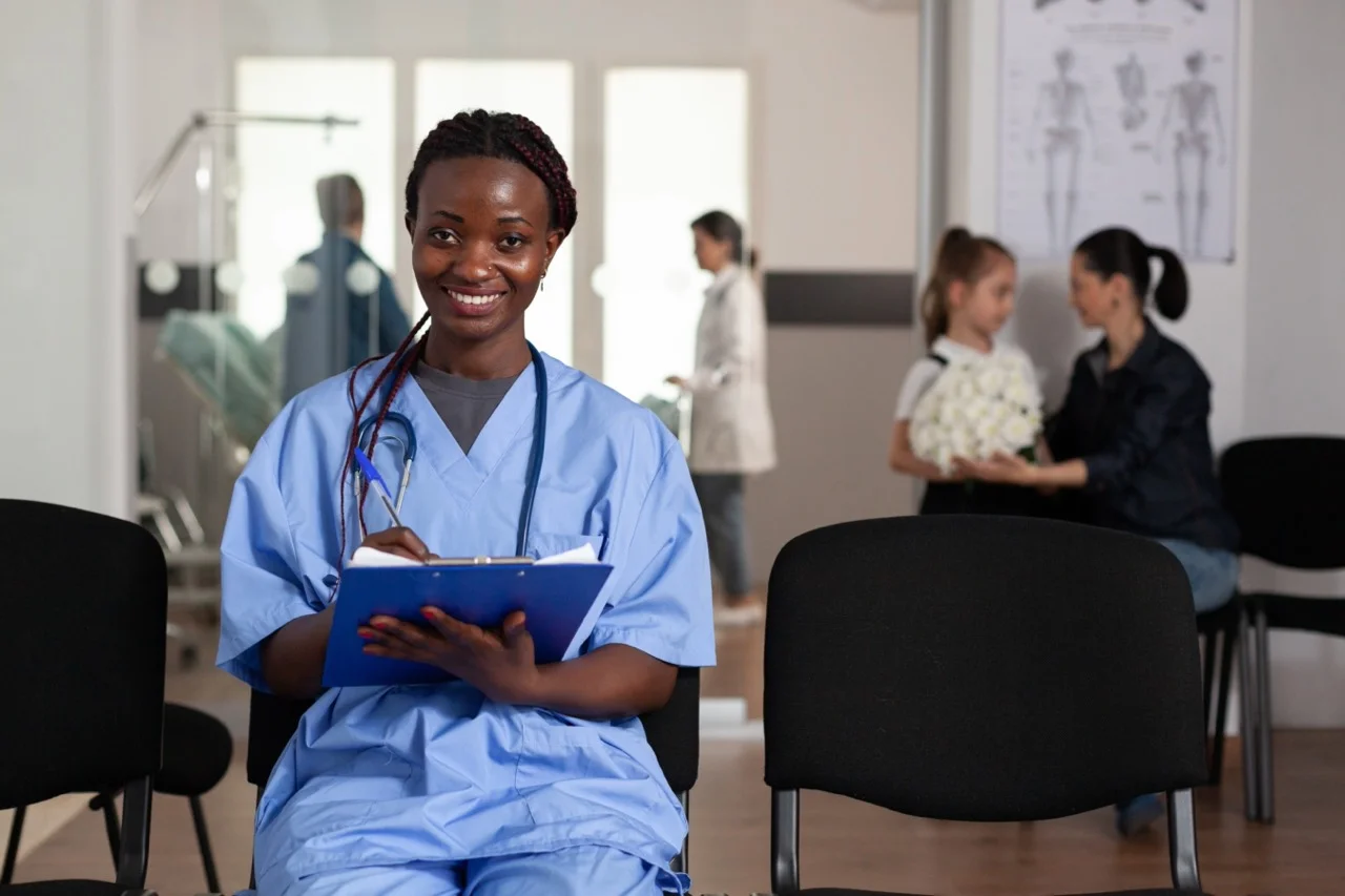 Nurse documenting results on a clipboard during an internal downtime audit
